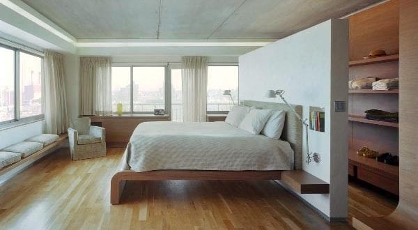 modernes interior design mit beton und holz für schlafzimmer mit begehbarem kleiderschrank